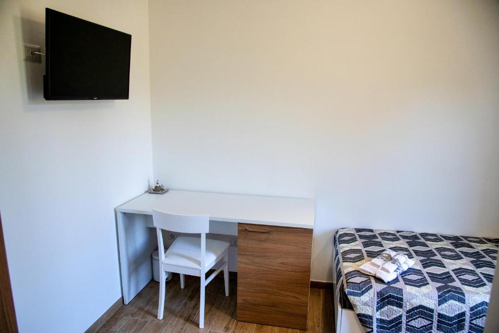 Posteľ alebo postele v izbe v ubytovaní b&b binario nove e tre quarti