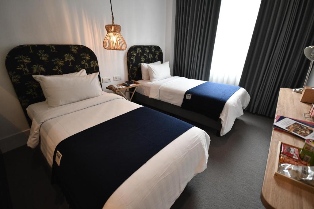 Voodi või voodid majutusasutuse Hotel Monopoli toas