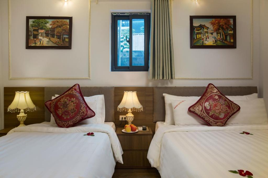 Postel nebo postele na pokoji v ubytování Hanoi City Gate Hotel