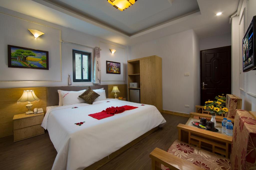 Postel nebo postele na pokoji v ubytování Hanoi City Gate Hotel