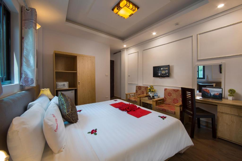 Postel nebo postele na pokoji v ubytování Hanoi City Gate Hotel