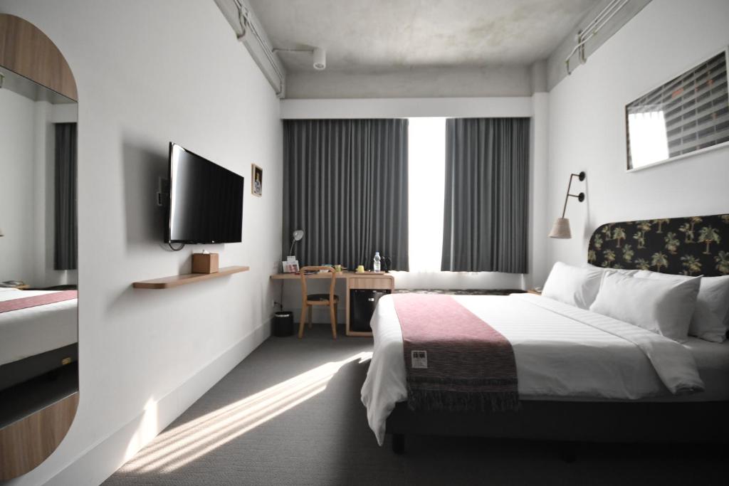 Voodi või voodid majutusasutuse Hotel Monopoli toas