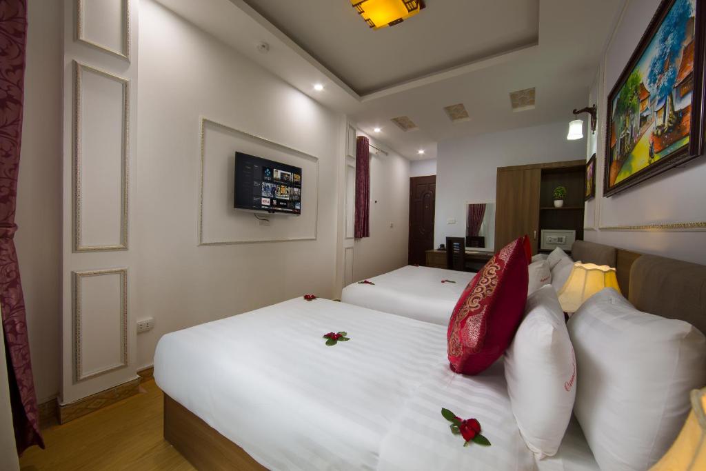 Postel nebo postele na pokoji v ubytování Hanoi City Gate Hotel