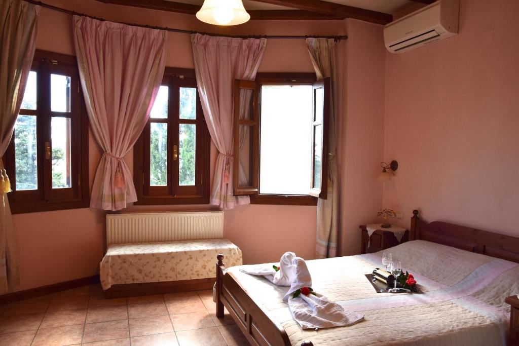 Postel nebo postele na pokoji v ubytování Aegean House
