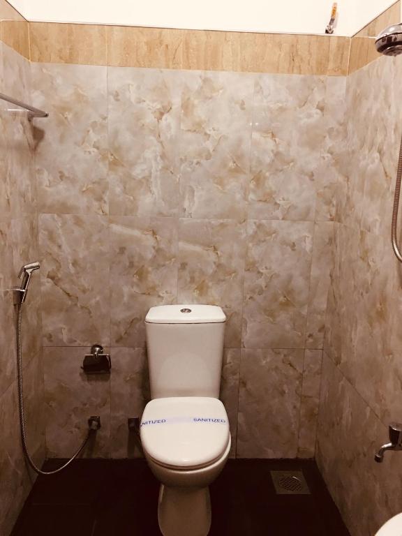 Koupelna v ubytování Sarvodaya Samma Vaasa Residence