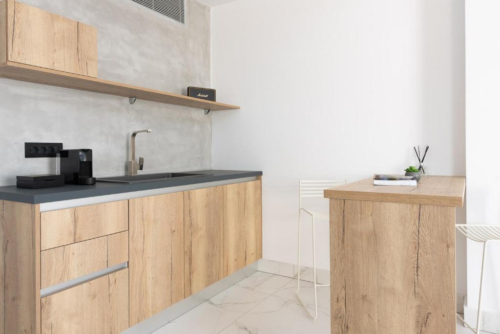 Kuchyň nebo kuchyňský kout v ubytování Karat Suites