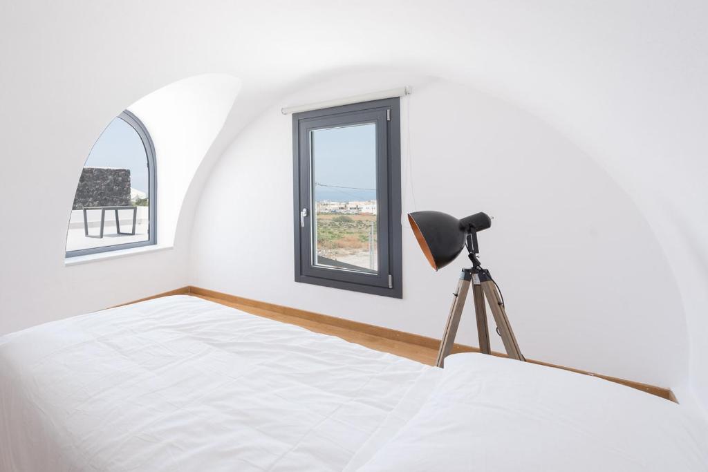 Postel nebo postele na pokoji v ubytování Karat Suites