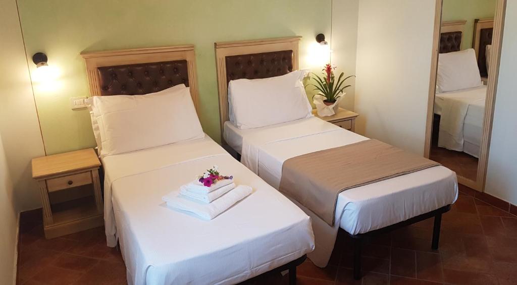 A bed or beds in a room at Casal Sant'Elena