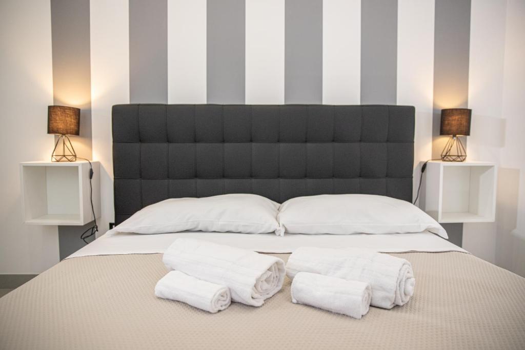 Postel nebo postele na pokoji v ubytování b&b Zio Luciano