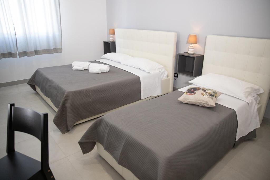 Postel nebo postele na pokoji v ubytování b&b Zio Luciano
