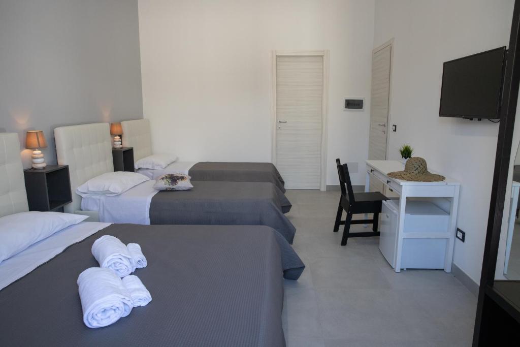 Postel nebo postele na pokoji v ubytování b&b Zio Luciano