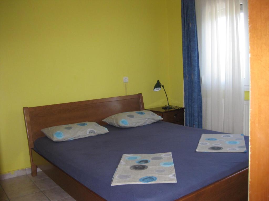 Postel nebo postele na pokoji v ubytování Europa Apartments Stefanos