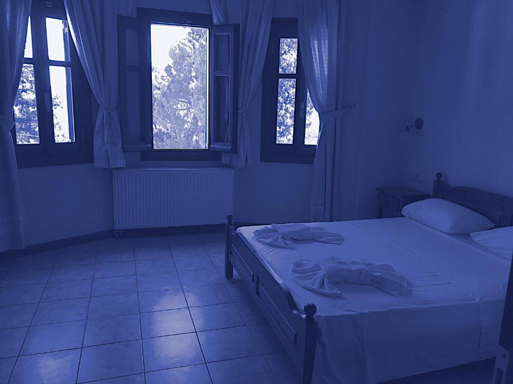 Postel nebo postele na pokoji v ubytování Aegean House