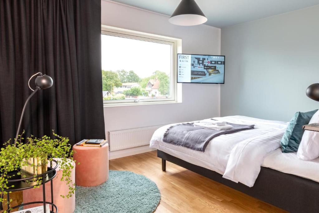 Postel nebo postele na pokoji v ubytování First Hotel Kokoloko