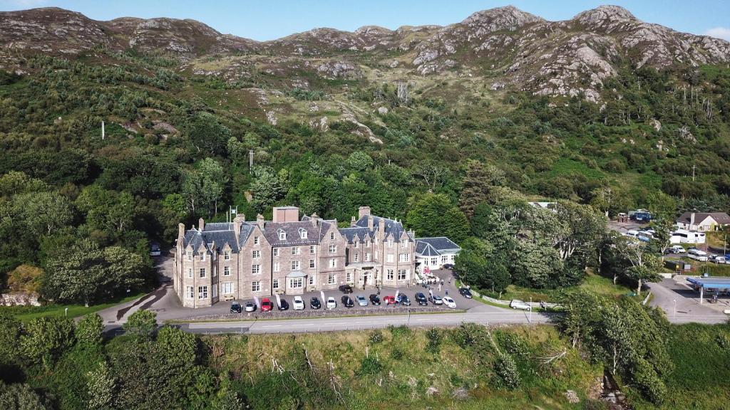 an aerial view of a large building on a mountain at Gairloch Hotel 'A Bespoke Hotel' in Gairloch