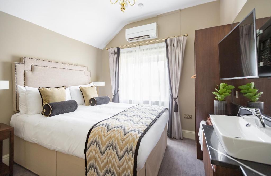 Posteľ alebo postele v izbe v ubytovaní Trinity Townhouse Hotel