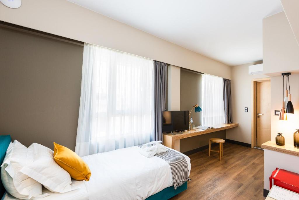 Posteľ alebo postele v izbe v ubytovaní St. Bjur Suites