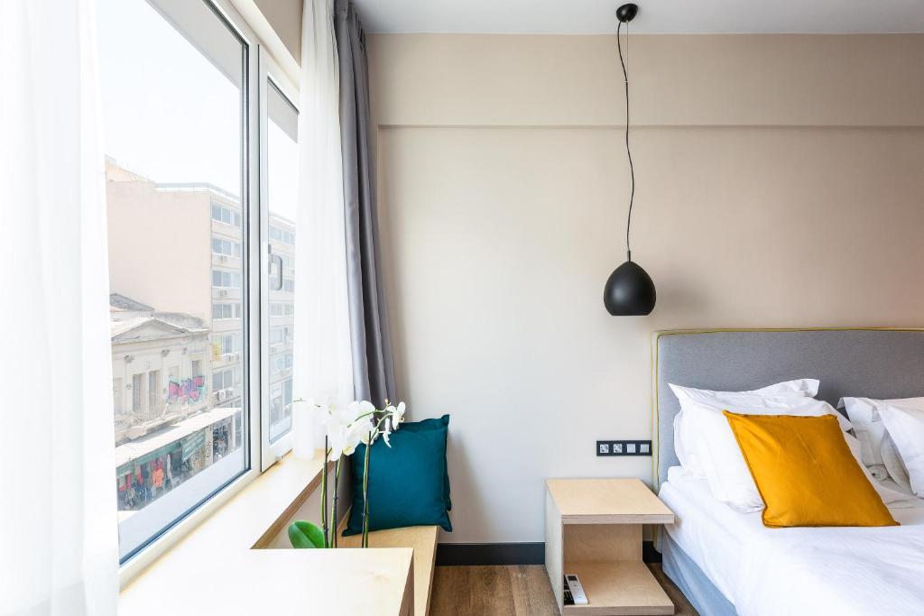 Posteľ alebo postele v izbe v ubytovaní St. Bjur Suites