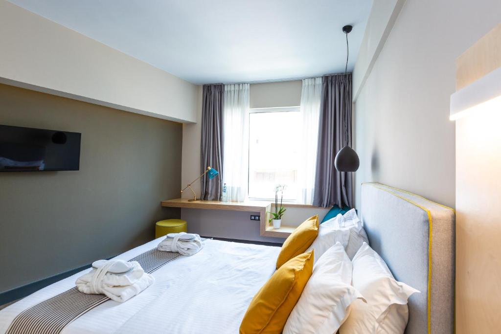 Posteľ alebo postele v izbe v ubytovaní St. Bjur Suites