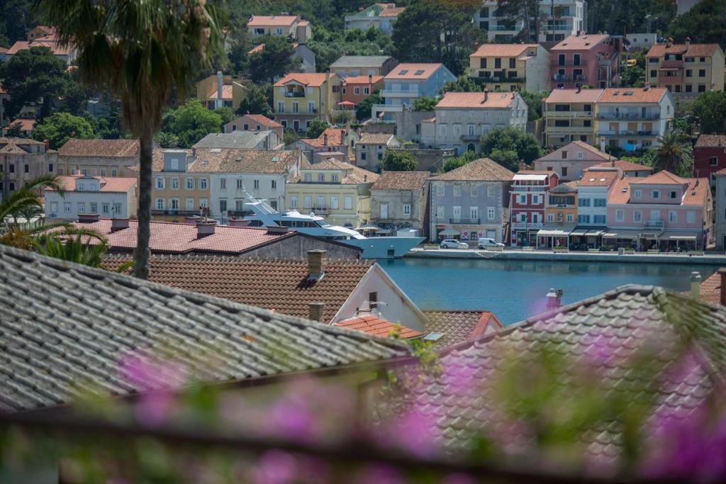 a view of a town with houses and a harbor at Apartment Sun view in Mali Lošinj