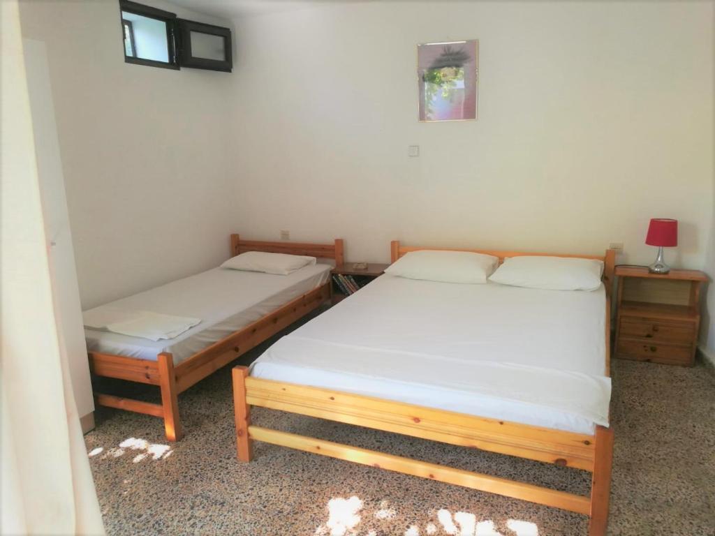 Postel nebo postele na pokoji v ubytování Stathis