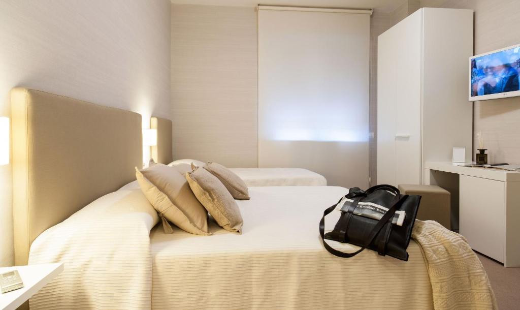 Postel nebo postele na pokoji v ubytování B&B Blanc