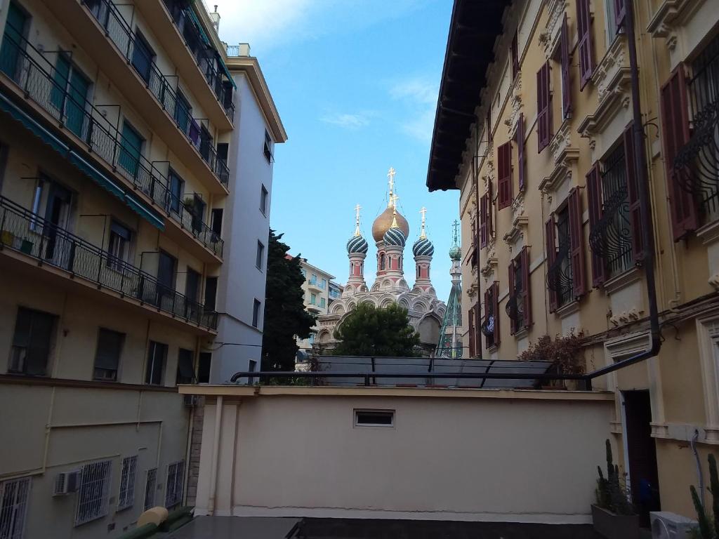 a view of a church from between buildings at imperatrice in Sanremo