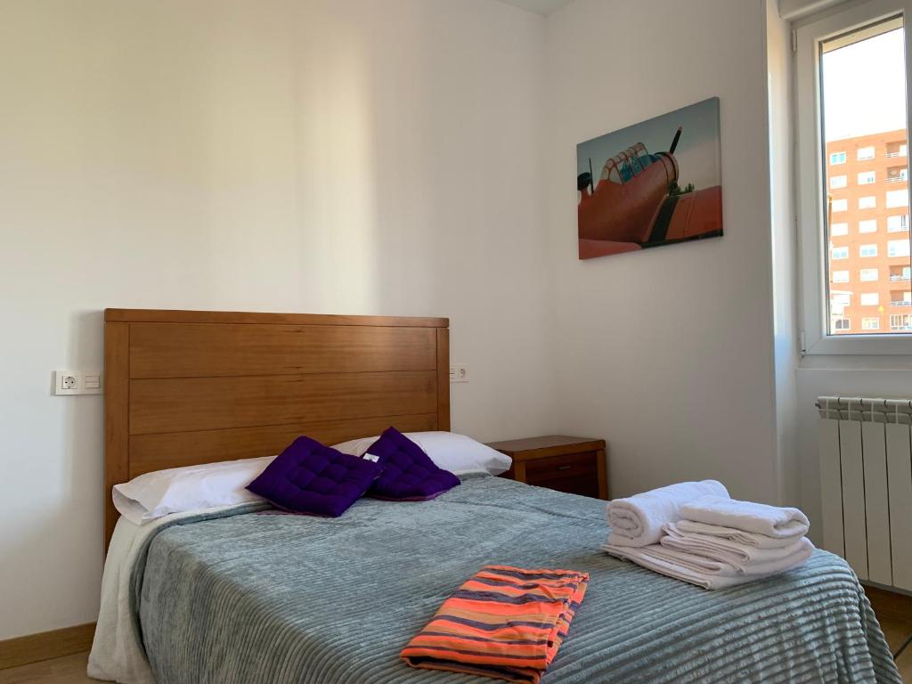 A bed or beds in a room at Alba Renueva 6
