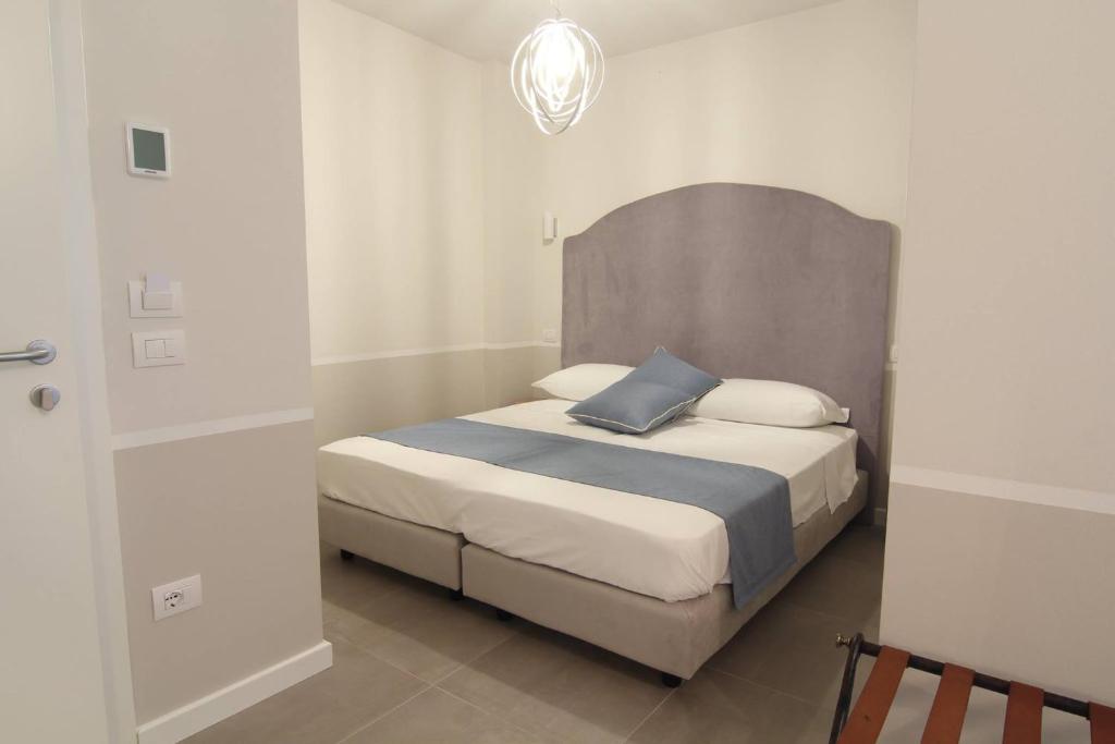 Postel nebo postele na pokoji v ubytování Spagnoi Rooms