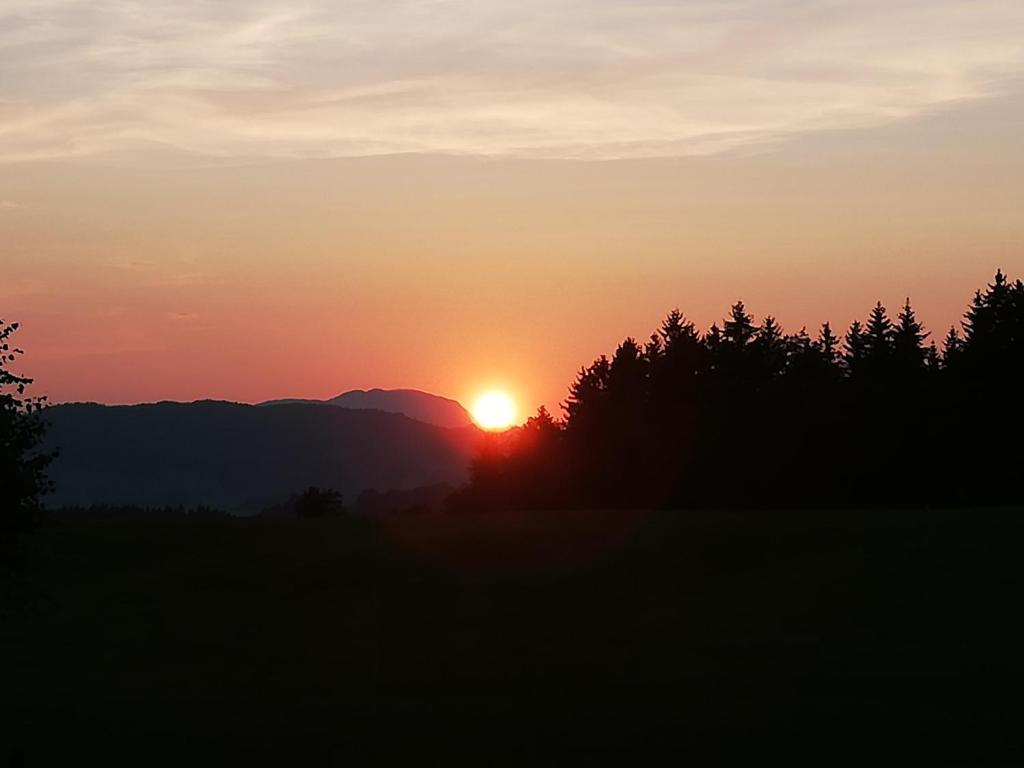 The sunrise or sunset as seen from a vendégházakat or nearby
