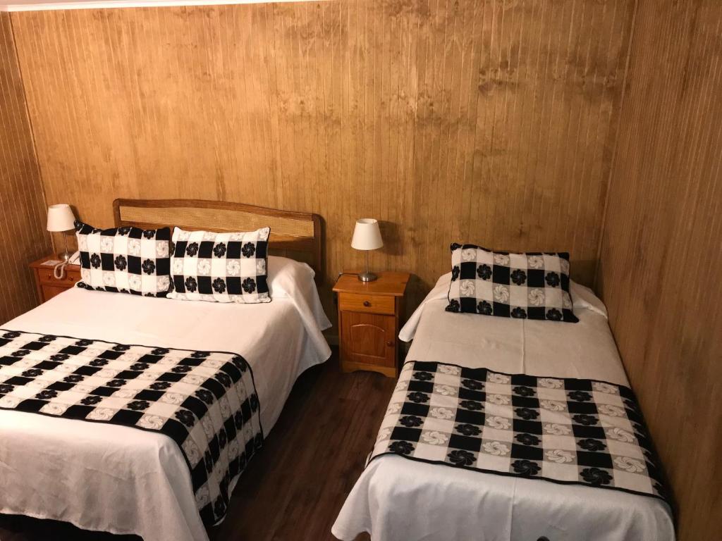 Postel nebo postele na pokoji v ubytování Hotel Luanco