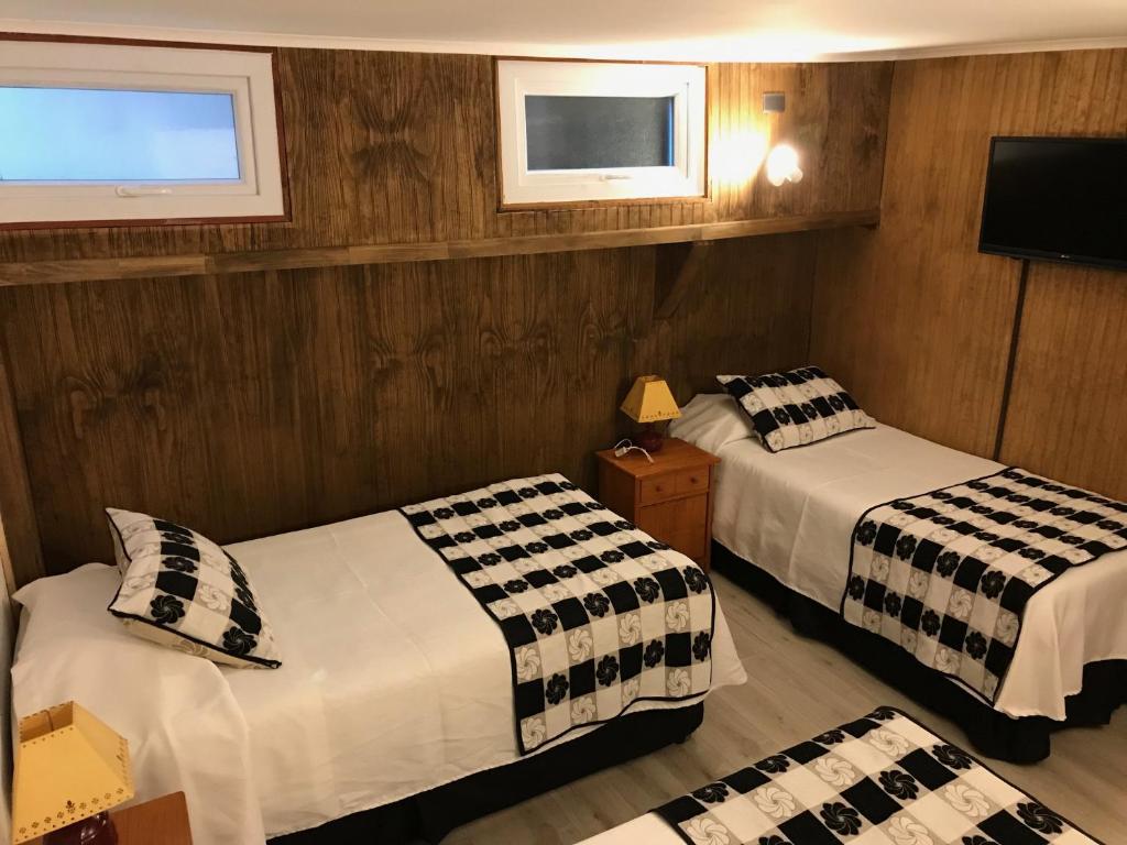 Postel nebo postele na pokoji v ubytování Hotel Luanco