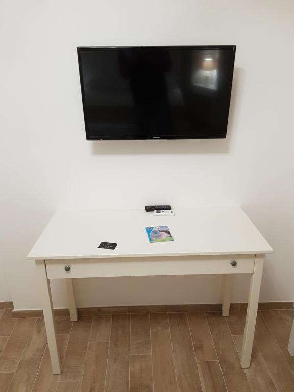 Telewizja i/lub zestaw kina domowego w obiekcie Royal House