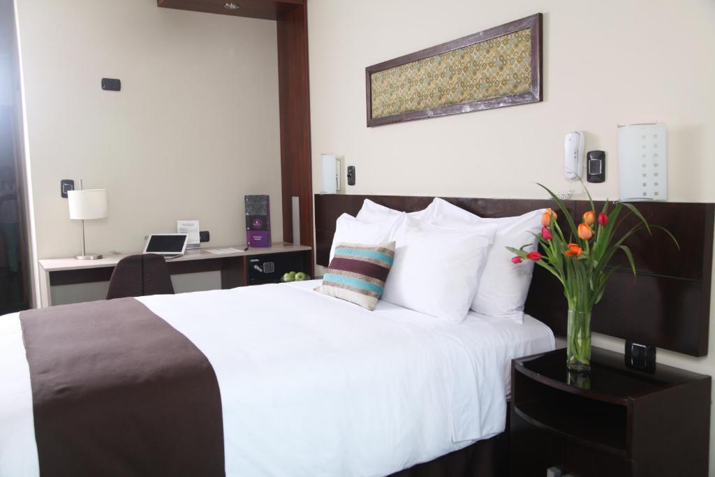 Postel nebo postele na pokoji v ubytování Hotel Rivera Inn
