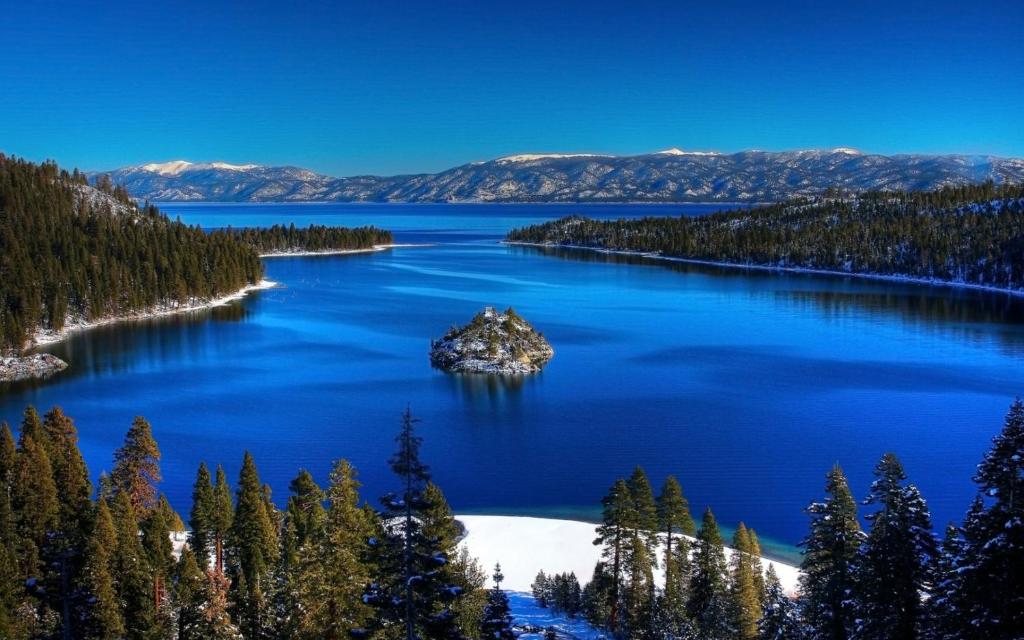 an island in the middle of a lake with trees at Rental In Tahoe in South Lake Tahoe