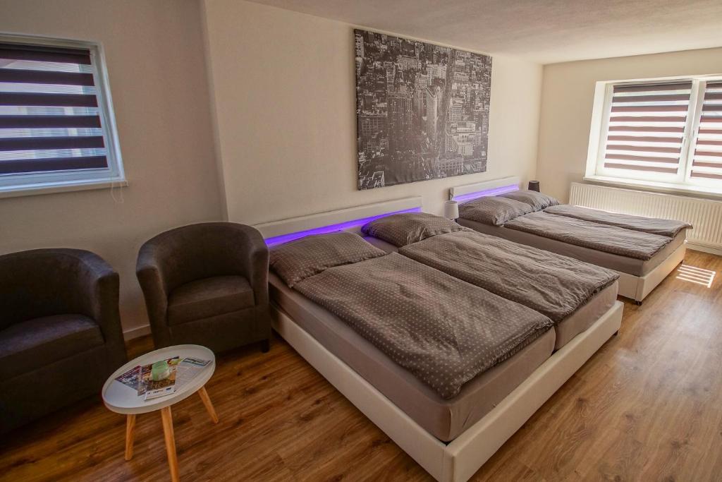 Postel nebo postele na pokoji v ubytování ARESKO-APARTMENTS