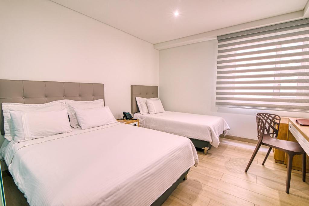 Postel nebo postele na pokoji v ubytování Hotel Dix