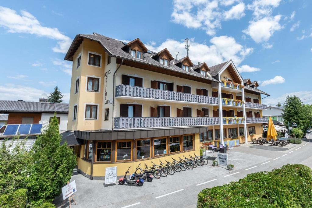 a hotel with bikes parked outside of it at Seelacherhof in Sankt Kanzian