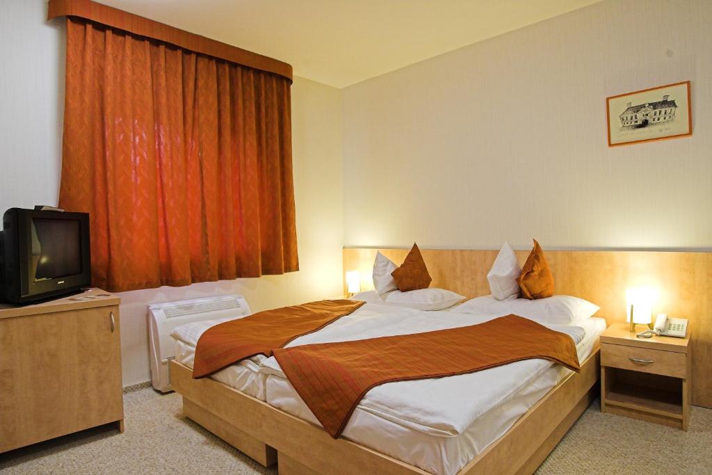 Postel nebo postele na pokoji v ubytování Völgyikút Ház