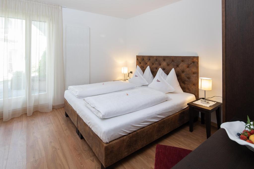 Postel nebo postele na pokoji v ubytování Residence Iris