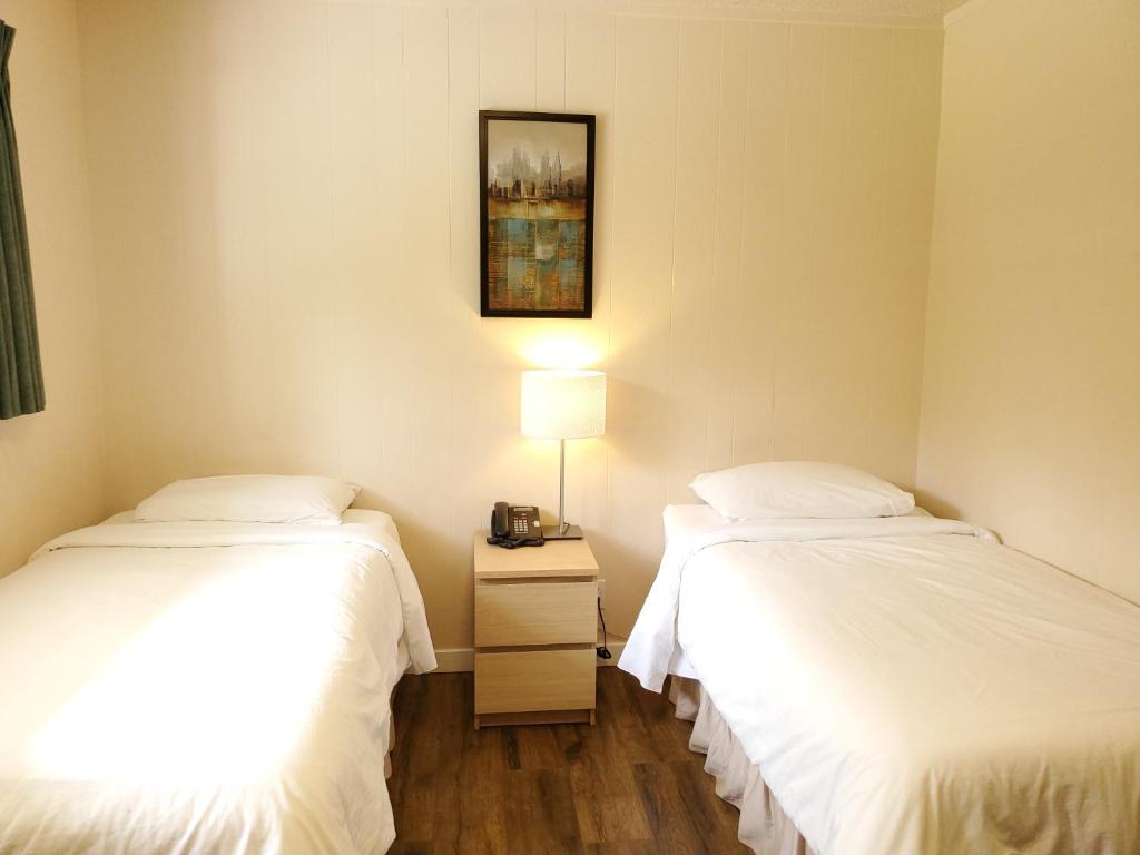 Postel nebo postele na pokoji v ubytování The Hitching Post Motel