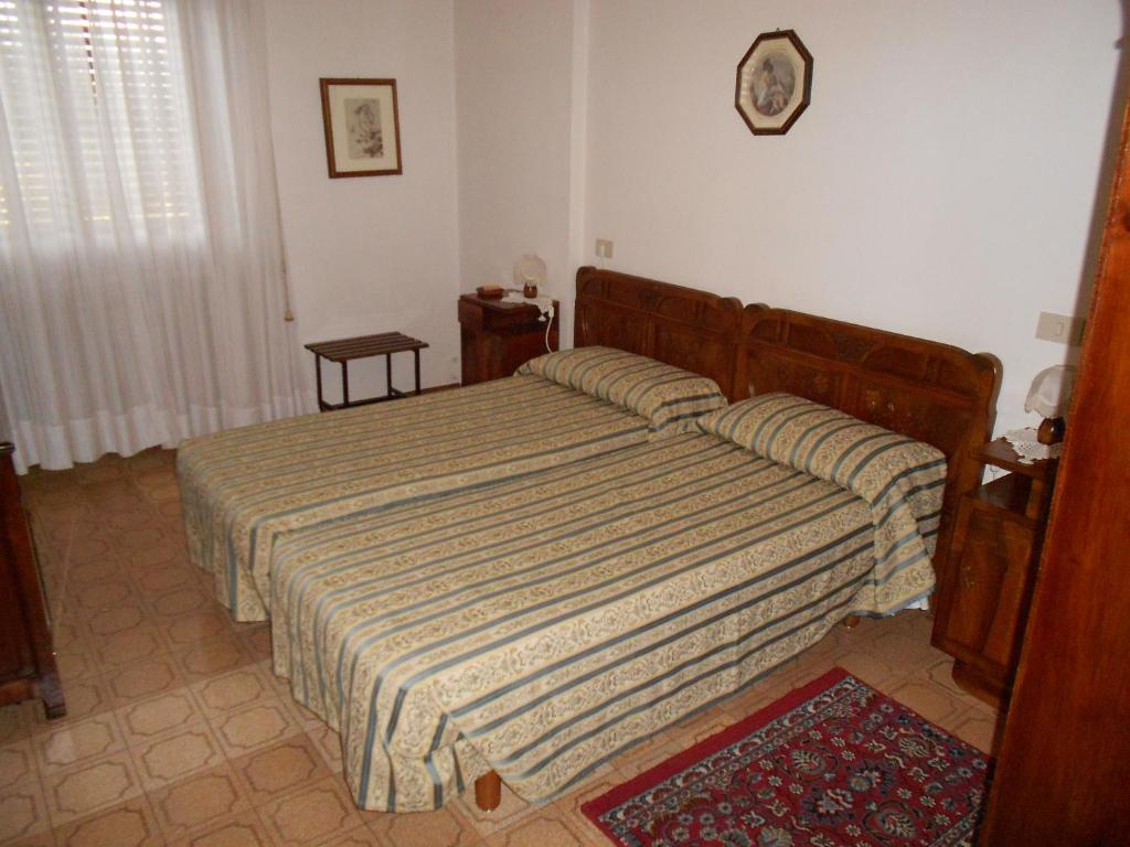 Postel nebo postele na pokoji v ubytování Hotel Rosati