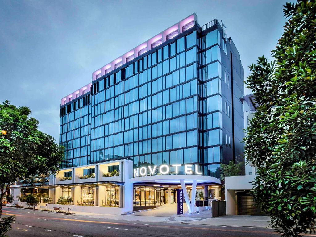 a building with a sign on the front of it at Novotel Brisbane South Bank in Brisbane