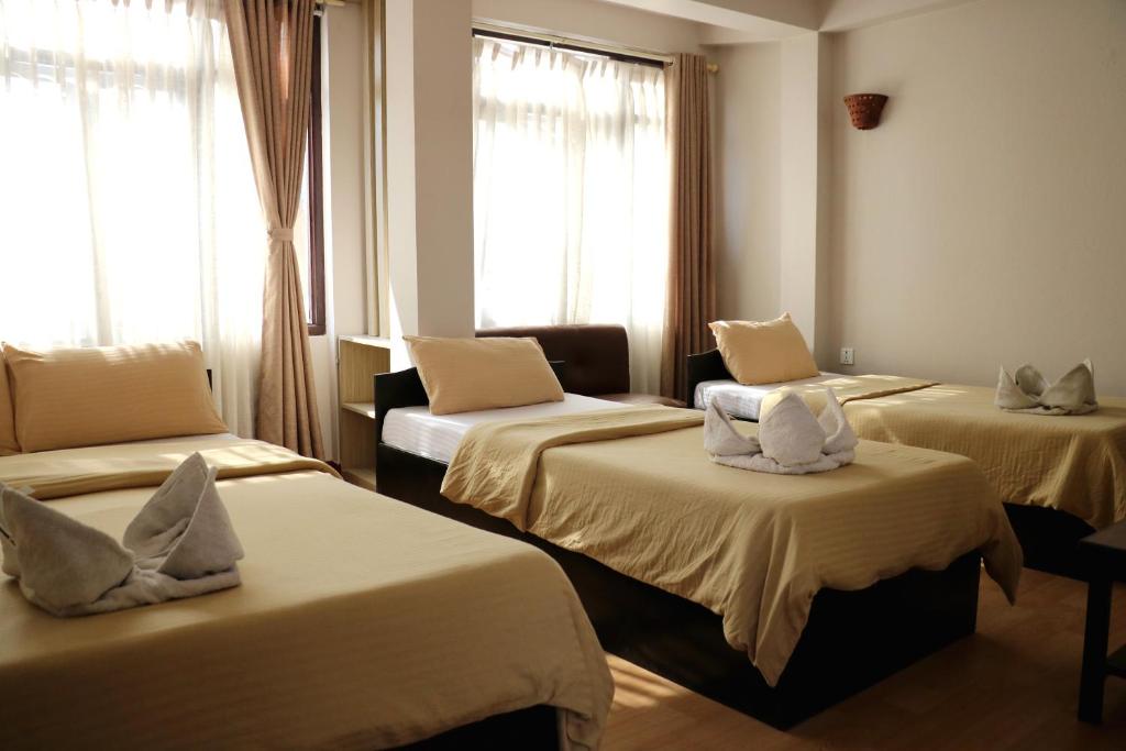 Postel nebo postele na pokoji v ubytování Hotel Yala Peak