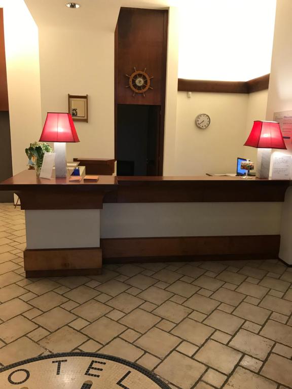 Postel nebo postele na pokoji v ubytování Hotel Miramare