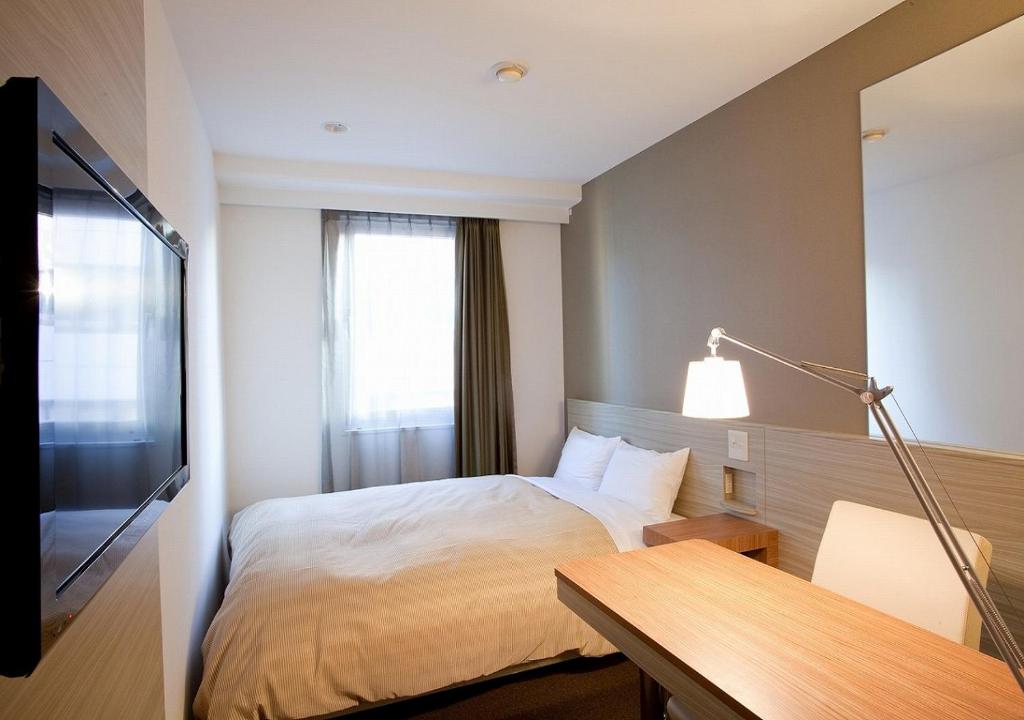 Postel nebo postele na pokoji v ubytování Hotel Sorriso Hamamatsu