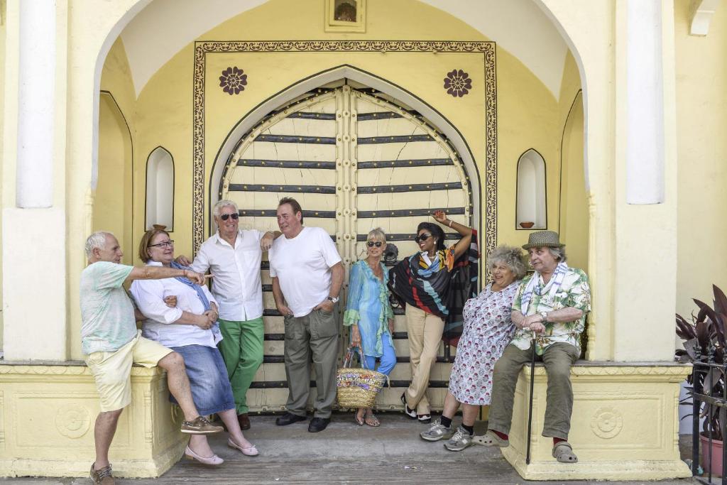 a group of people posing in front of a door at Khatu Haveli in Jaipur