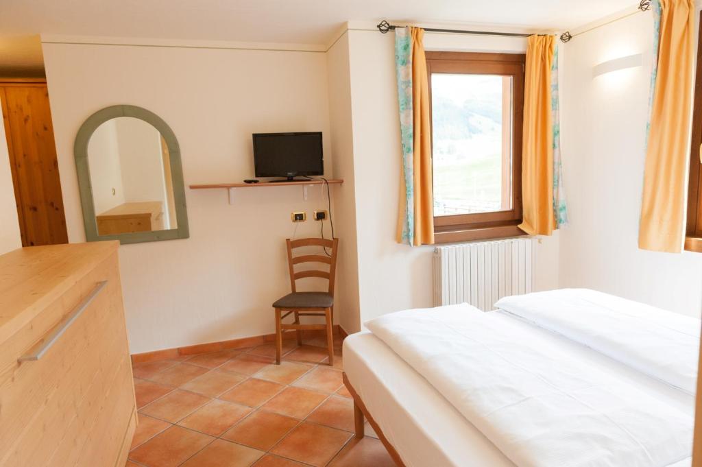 Letto o letti in una camera di Residence Bait da Mott