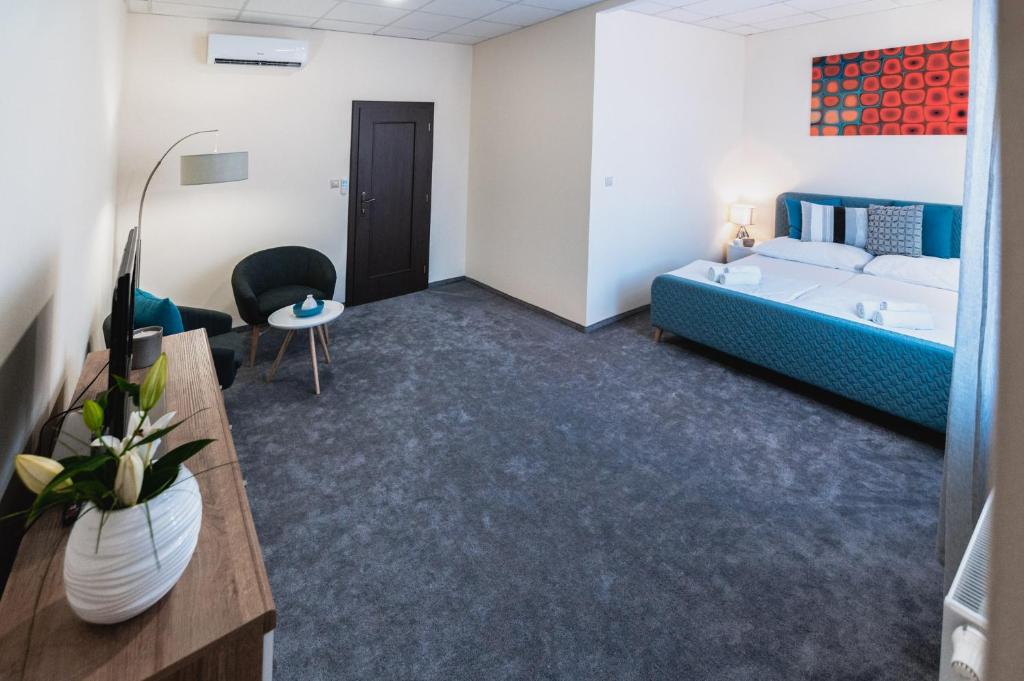 Postel nebo postele na pokoji v ubytování Apartmány na Bašte