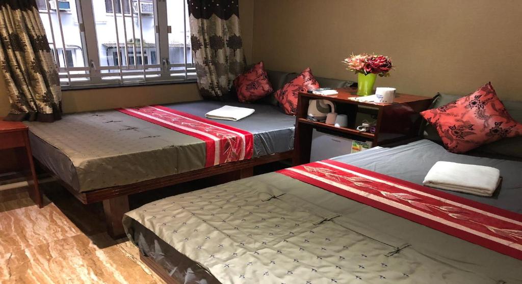Postel nebo postele na pokoji v ubytování Rich Hostel